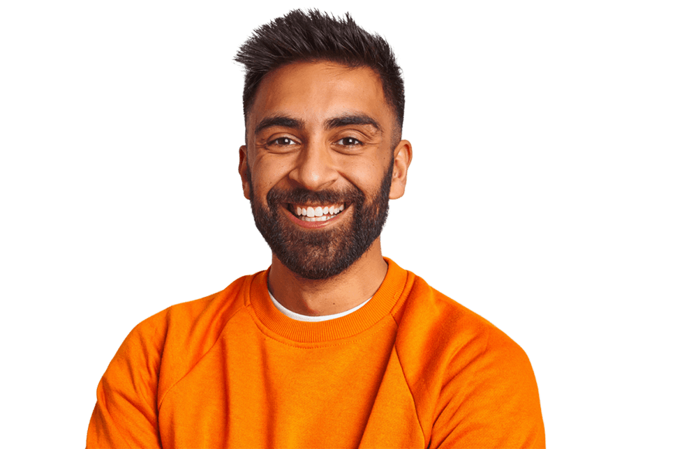 Hero image of a man smiling in orange sweater
